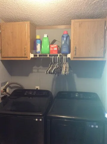 a kitchen with a sink and a stove top oven