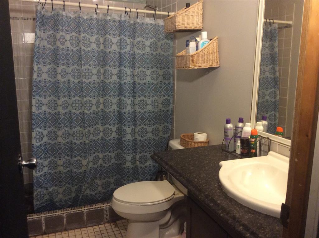 8762 Private Road 4641 Baird, TX 79504 - Photo 16 of 36 a bathroom with a sink and a toilet
