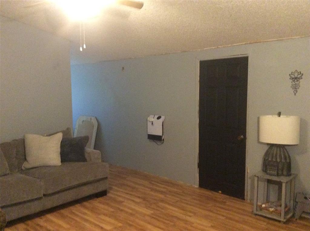 8762 Private Road 4641 Baird, TX 79504 - Photo 8 of 36 a living room with furniture and wooden floor