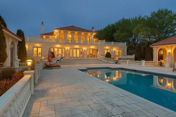 a view of a swimming pool with sitting area