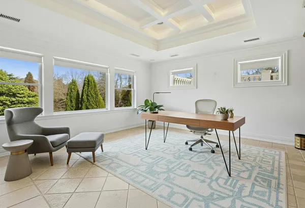 a bathroom with bathtub and window