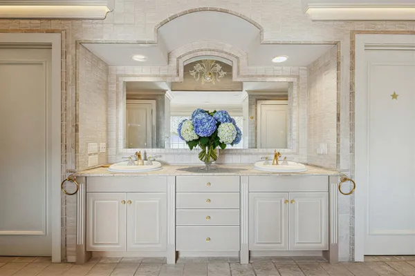 a living room with furniture fireplace and window