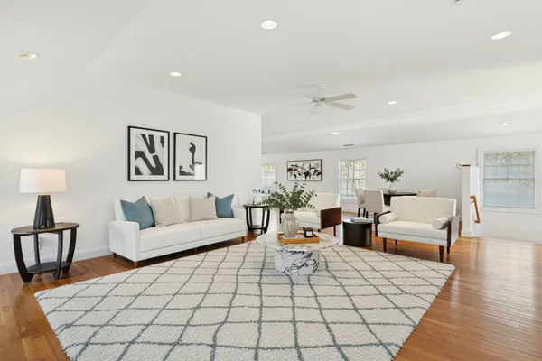 a bedroom with two beds and a night stand