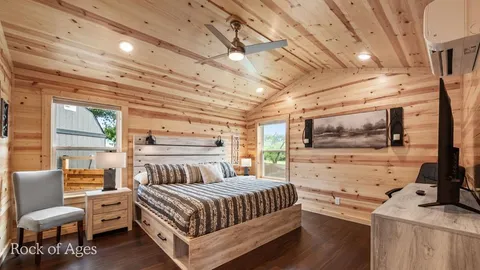 a bathroom with a sink a mirror and shower
