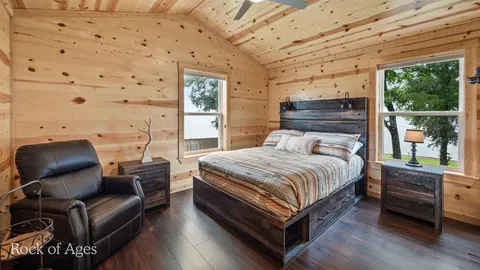 a view of a chair and tables in the balcony