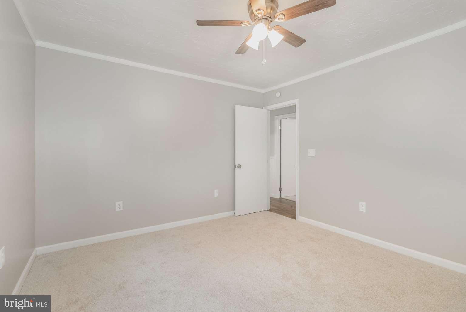 475 Company Farm Road Aspers, PA 17304 - Photo 18 of 45 an empty room with a chandelier fan and closet area