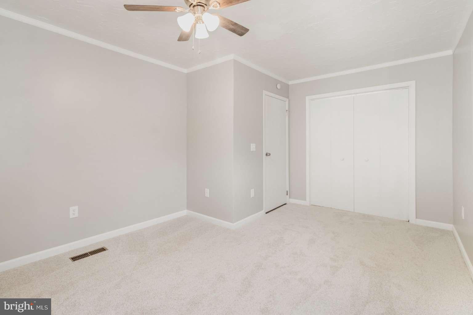 475 Company Farm Road Aspers, PA 17304 - Photo 21 of 45 an empty room with a chandelier fan