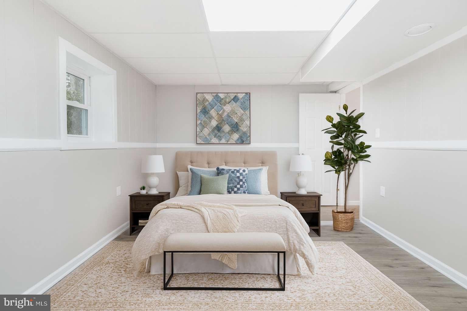 475 Company Farm Road Aspers, PA 17304 - Photo 26 of 45 a bedroom with a bed table and a potted plant