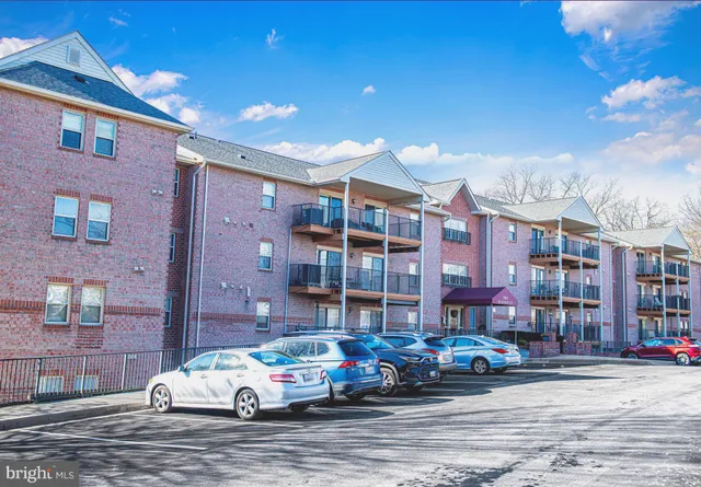 a car parked in front of a brick building