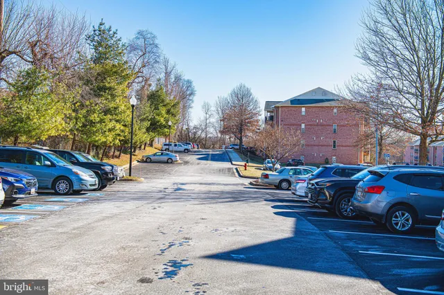 a view of street with parked cars
