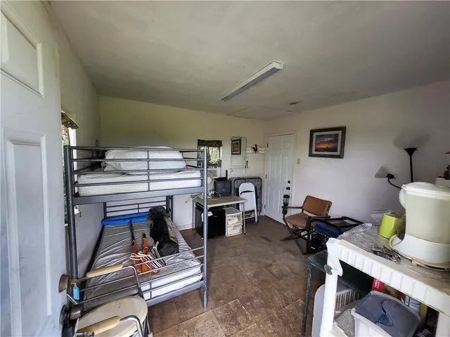 a room with gym equipment and a window