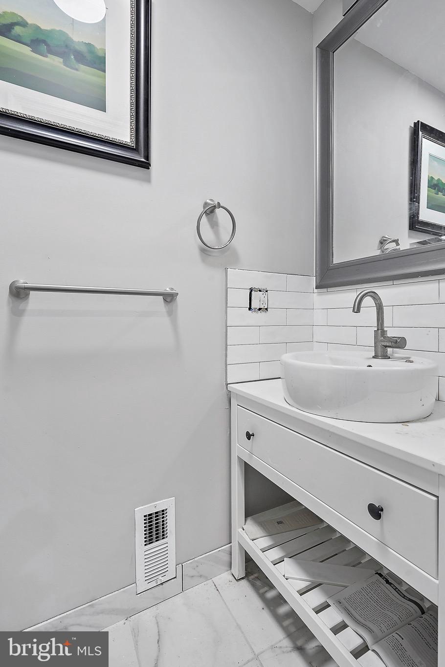 7419 Farnum Street Springfield, VA 22151 - Photo 10 of 26 a bathroom with a sink and a mirror