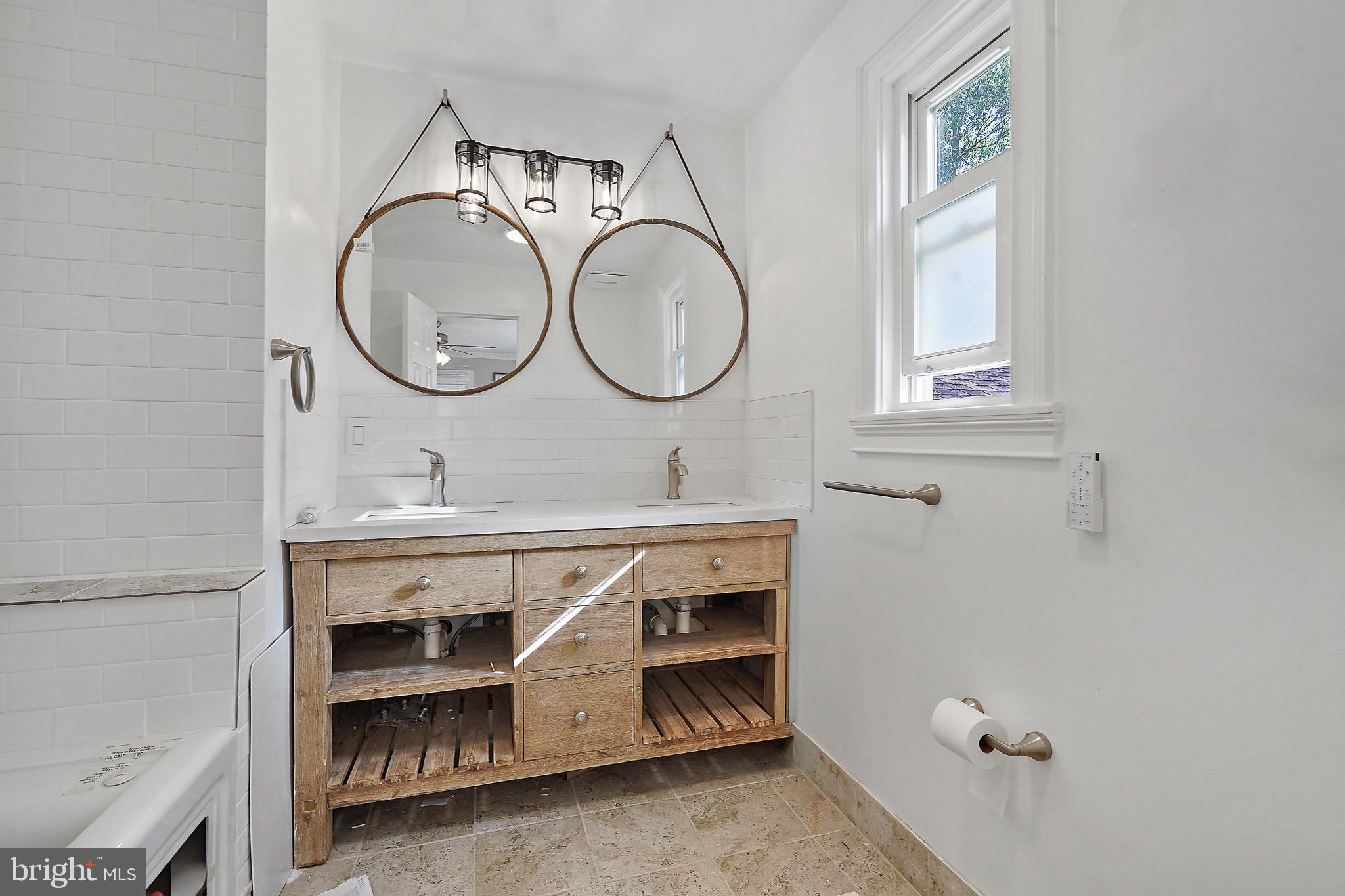 7419 Farnum Street Springfield, VA 22151 - Photo 13 of 26 a bathroom with a sink a mirror and a toilet