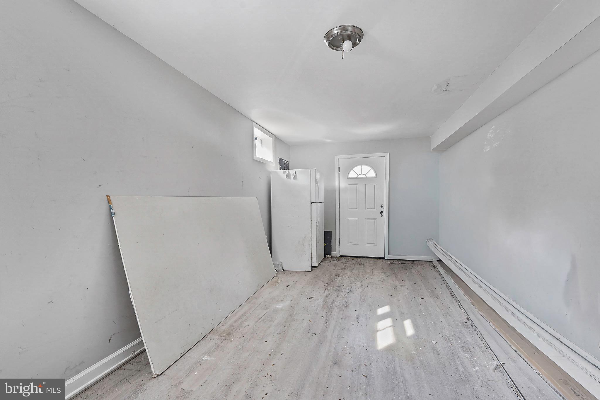 7419 Farnum Street Springfield, VA 22151 - Photo 17 of 26 a view of a room with wooden floor and white doors