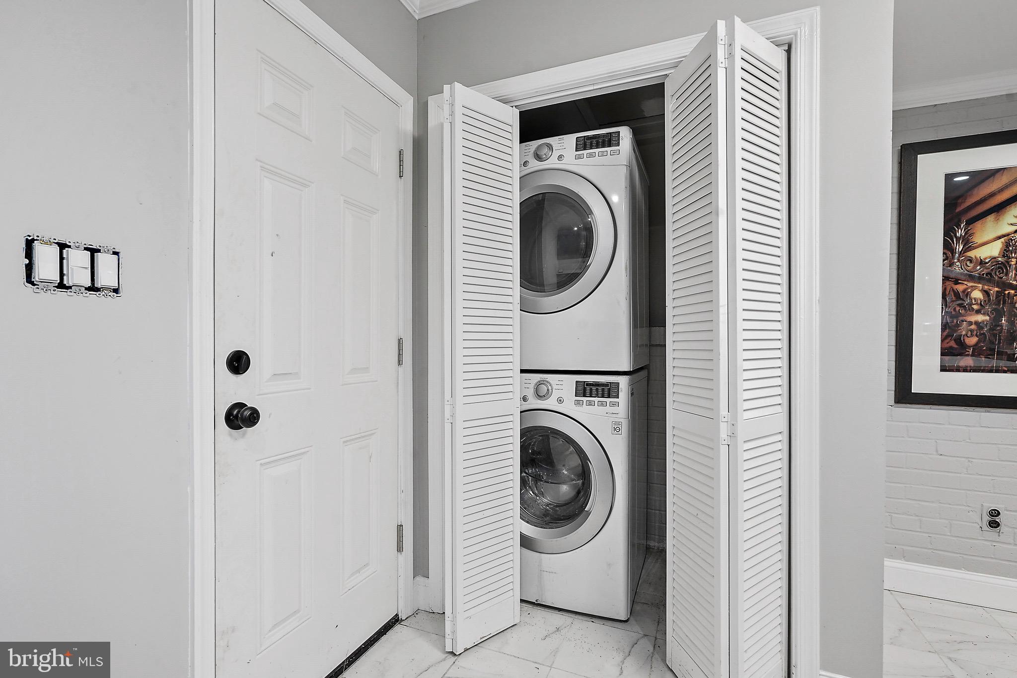 7419 Farnum Street Springfield, VA 22151 - Photo 8 of 26 a utility room with dryer and washer
