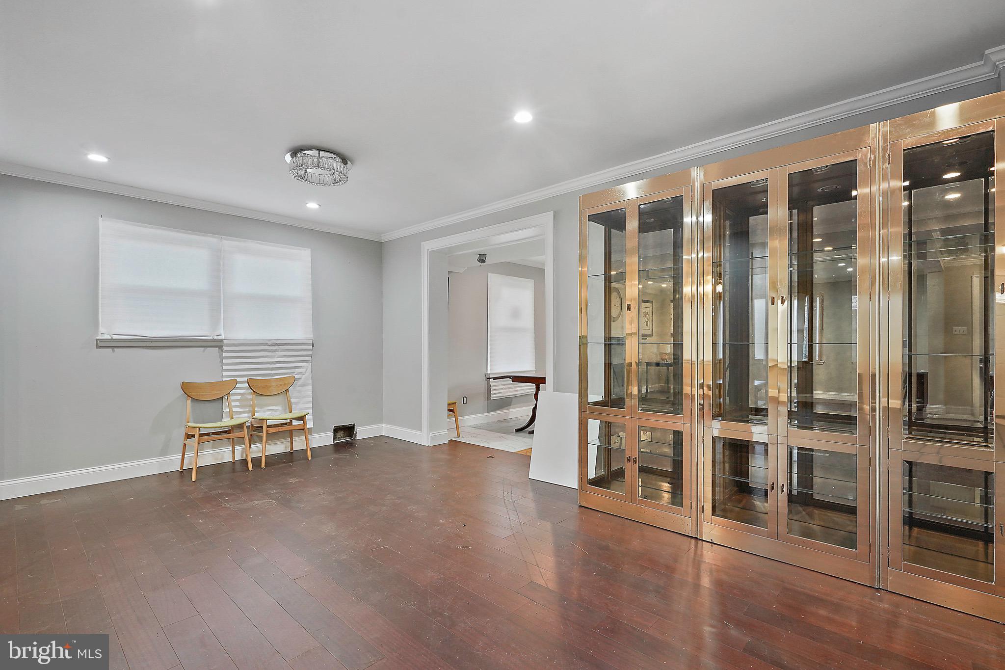 7419 Farnum Street Springfield, VA 22151 - Photo 26 of 26 a view of a big room with wooden floor and windows