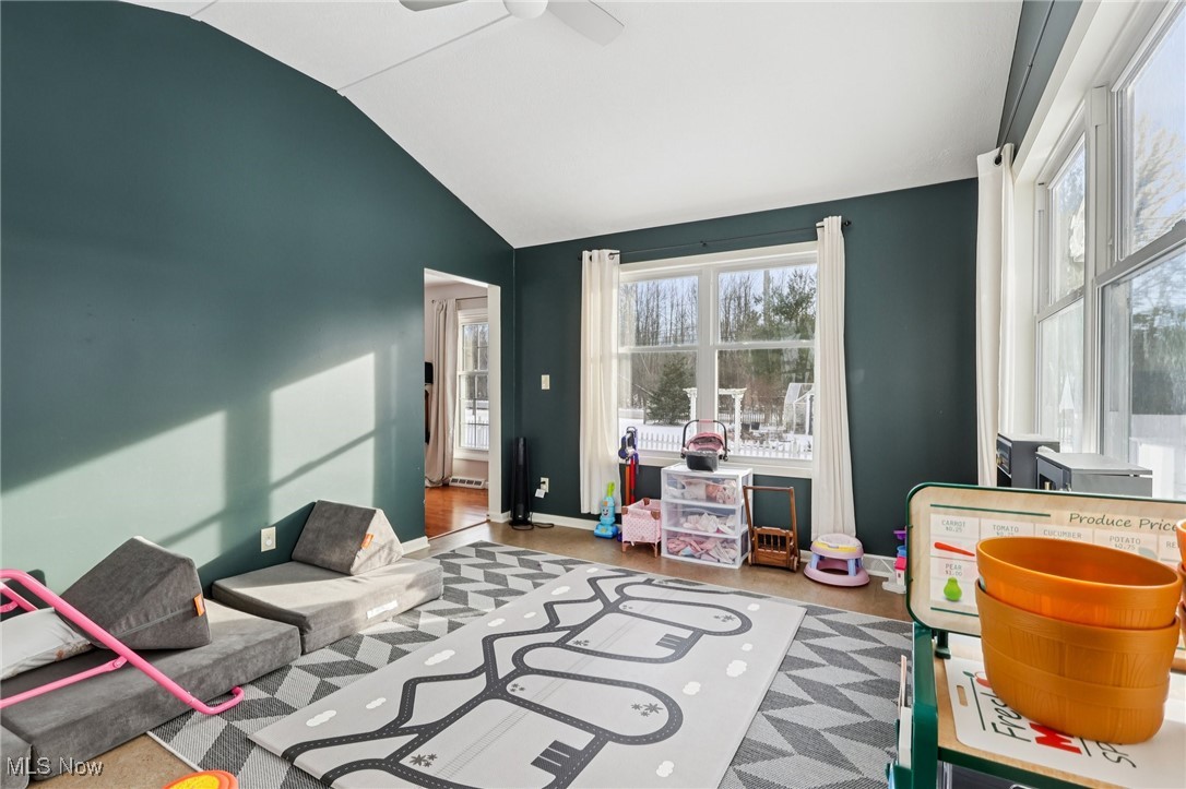 445 Center Road Hinckley, OH 44233 - Photo 16 of 50 Playroom with vaulted ceiling, ceiling fan, and wood finished floors