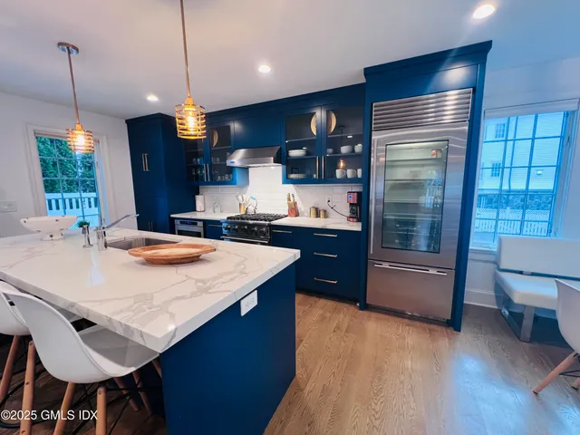 a kitchen with a table and chairs in it