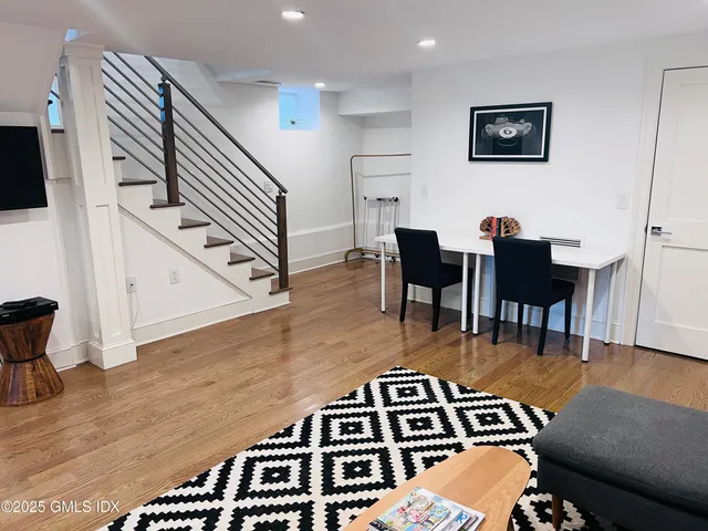 a bathroom with a double vanity sink toilet and shower