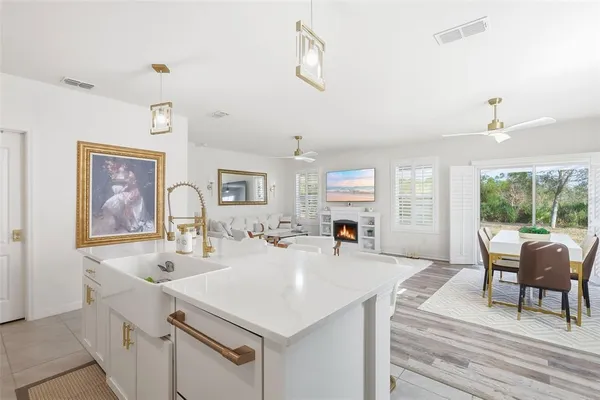 a view of kitchen island a sink and living room
