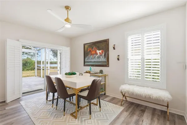 a view of a dining room with furniture window and outside view