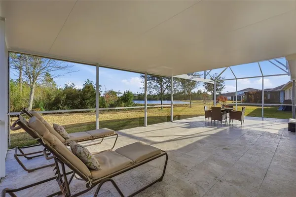 a view of swimming pool with sitting area
