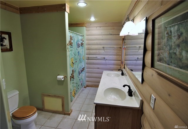 1072 Dabob Road Quilcene, WA 98376 - Photo 16 of 25 a bathroom with a sink toilet and shower