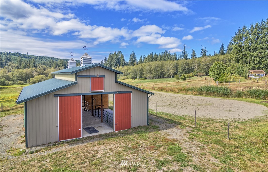 1072 Dabob Road Quilcene, WA 98376 - Photo 19 of 25 a view of a house with a yard