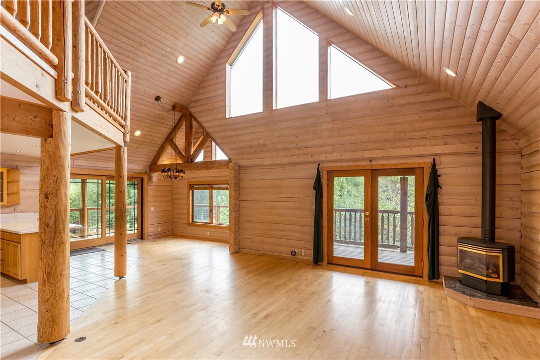 1072 Dabob Road Quilcene, WA 98376 - Photo 5 of 25 a view of a house with an empty space and wooden floor