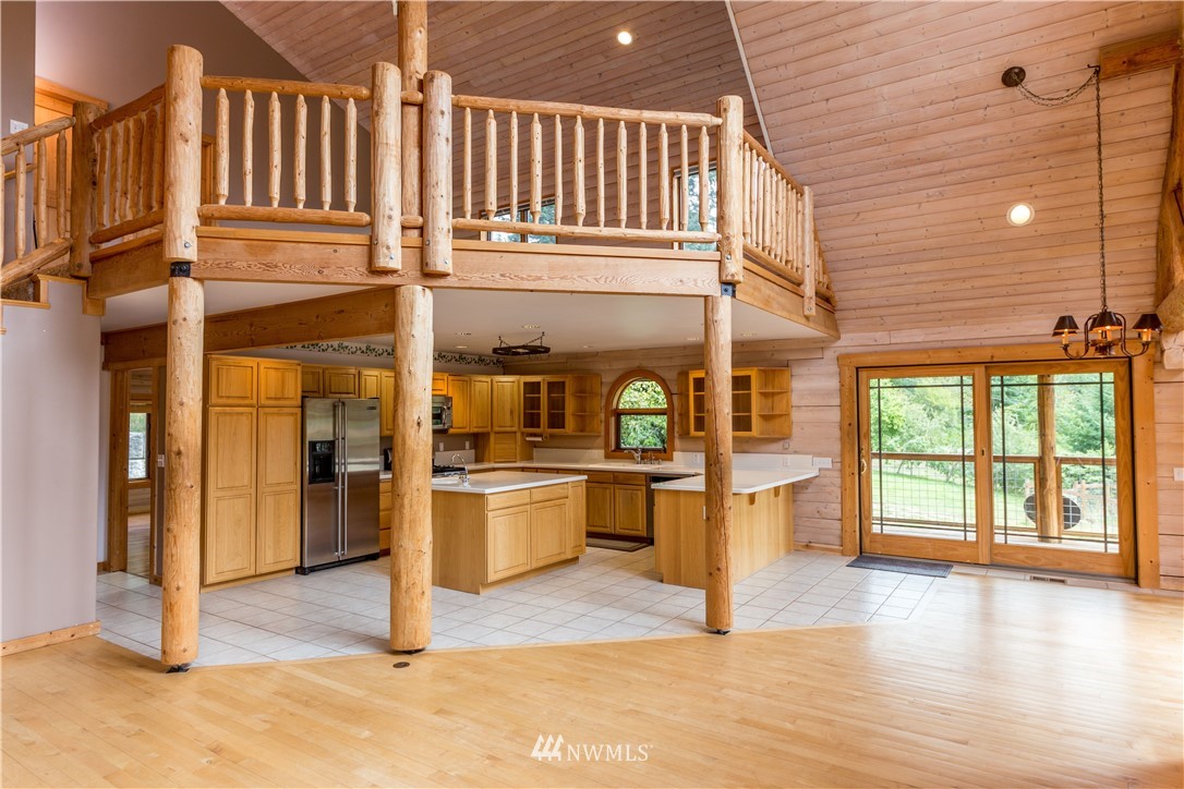 1072 Dabob Road Quilcene, WA 98376 - Photo 6 of 25 a kitchen with stainless steel appliances granite countertop a stove and cabinets