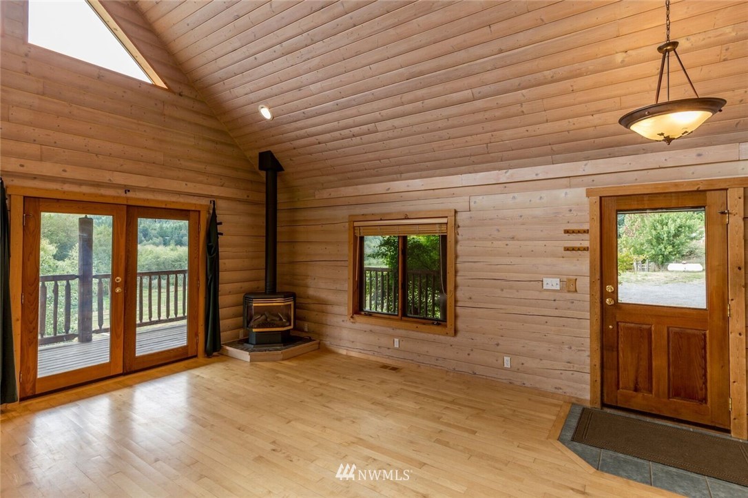 1072 Dabob Road Quilcene, WA 98376 - Photo 7 of 25 a view of a room with wooden floor and windows