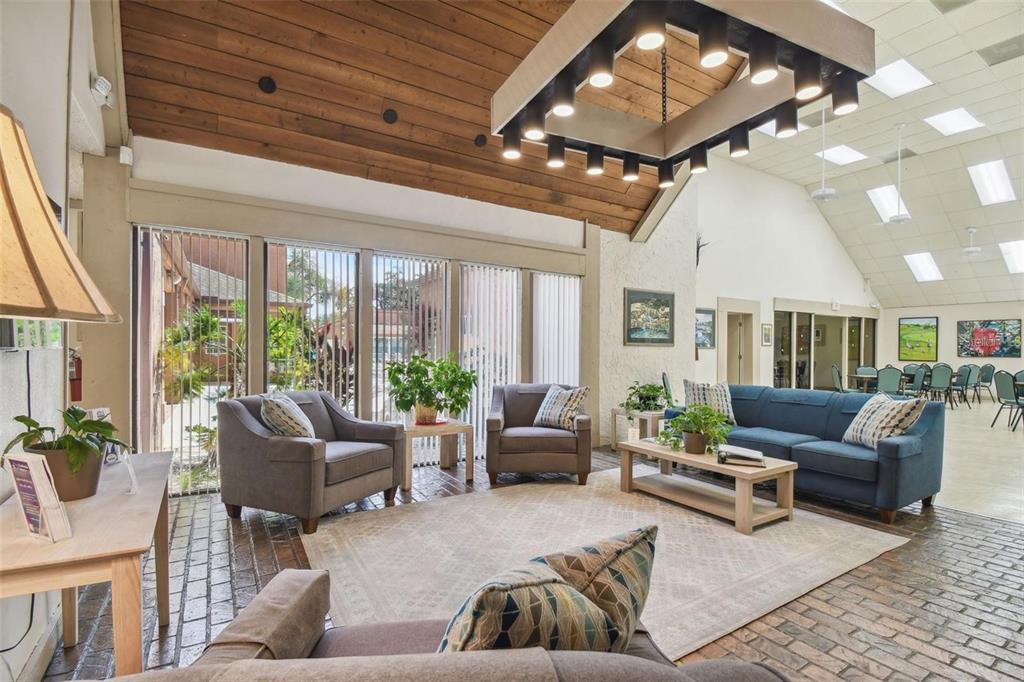 8302 Split Rail Lane Hudson, FL 34667 - Photo 16 of 21 a living room with furniture and a large window
