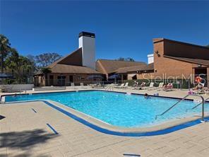 8302 Split Rail Lane Hudson, FL 34667 - Photo 19 of 21 a view of a swimming pool with outdoor seating