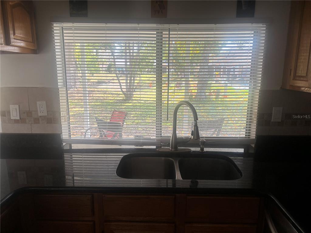 8302 Split Rail Lane Hudson, FL 34667 - Photo 6 of 21 a bathroom with a sink and a window