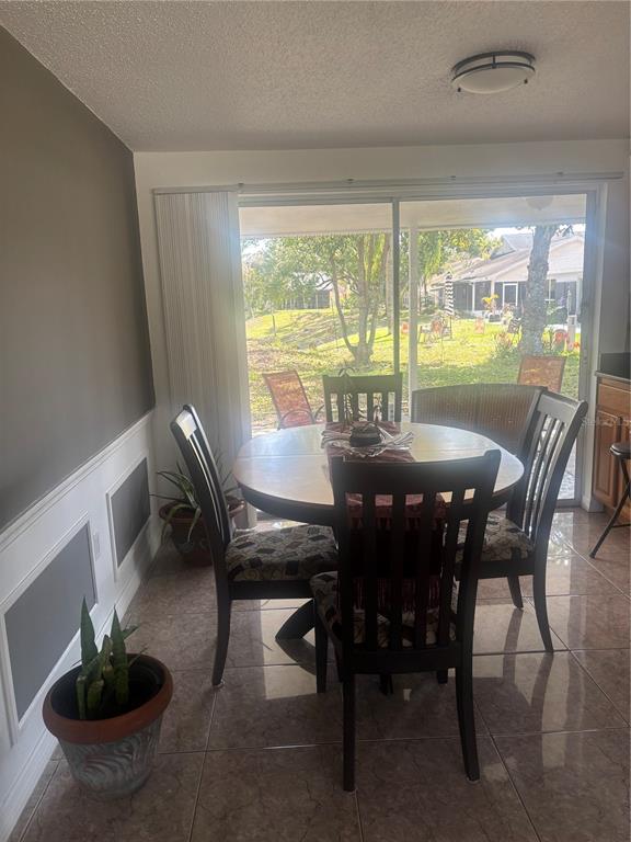 8302 Split Rail Lane Hudson, FL 34667 - Photo 7 of 21 a view of a dining room with furniture window and outside view