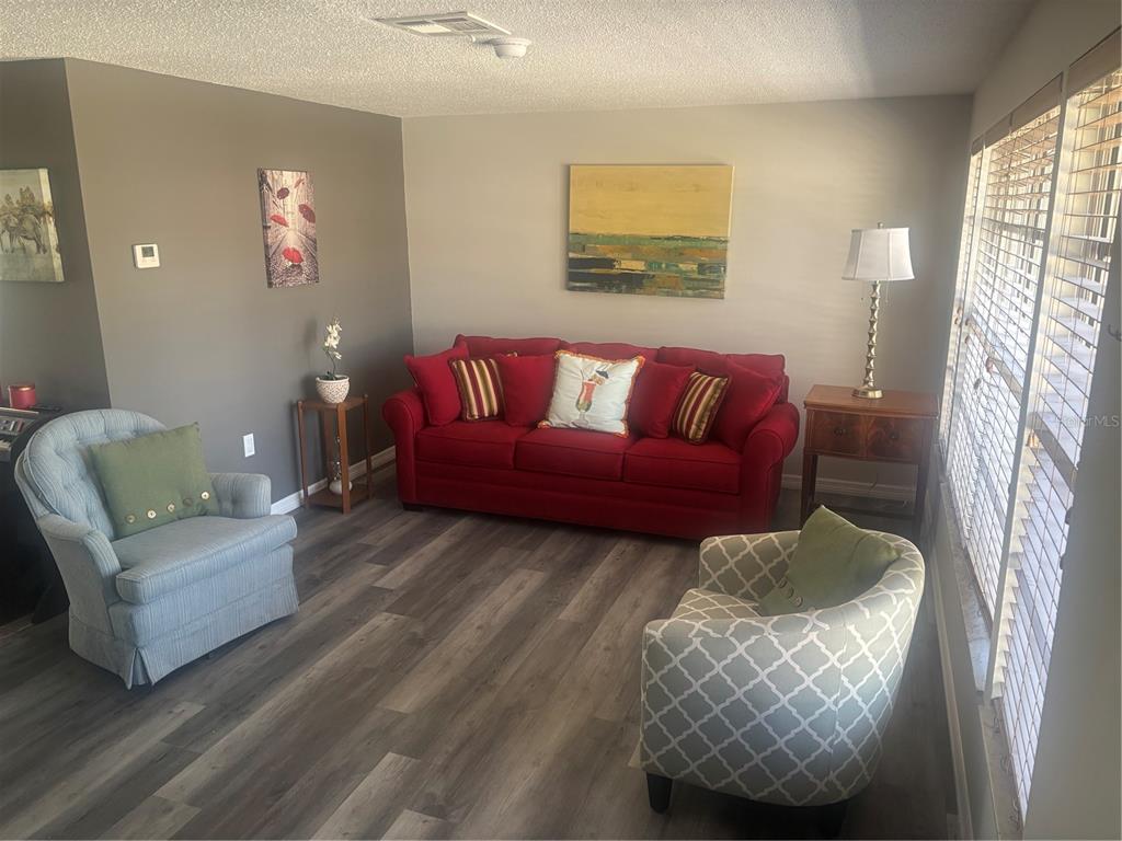 8302 Split Rail Lane Hudson, FL 34667 - Photo 8 of 21 a living room with furniture and a couch