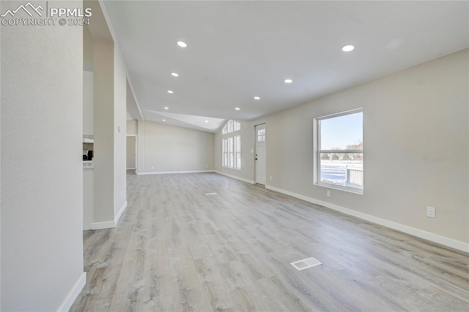 6605 Rio Road Peyton, CO 80831 - Photo 20 of 45 Unfurnished living room with light wood-type flooring
