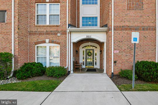 9511 Kingscroft Terrace, Unit 9511F Perry Hall, MD 21128 - Photo 3 of 38 a front view of a house with garden