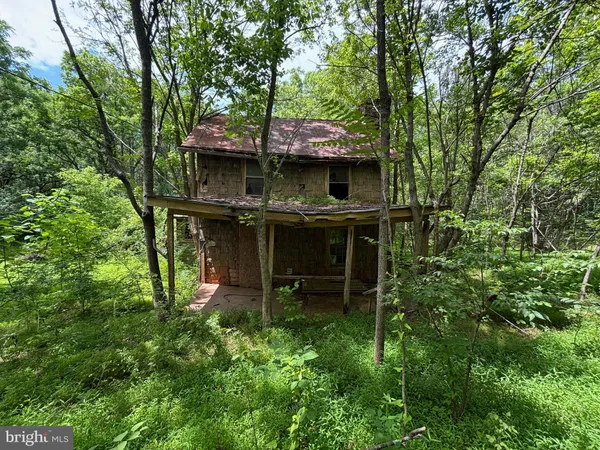 front view of a house with a garden