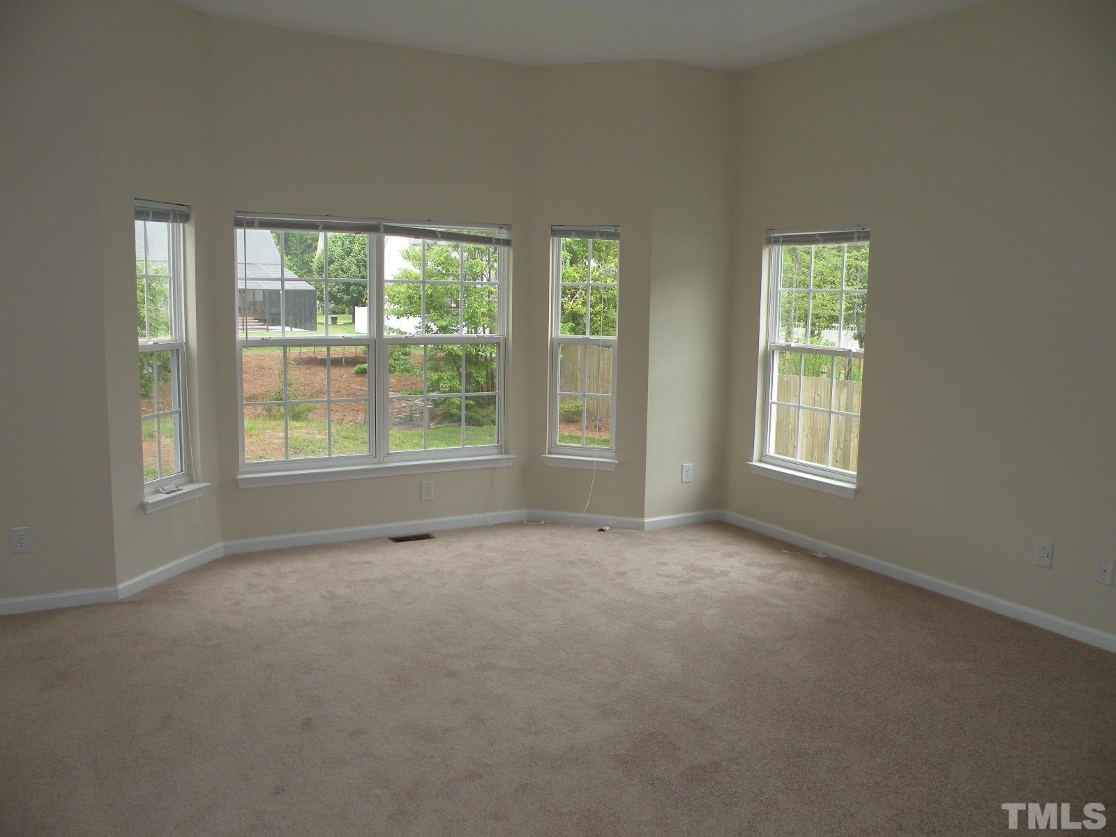 4733 Porchaven Lane Apex, NC 27539 - Photo 13 of 25 an empty room with windows