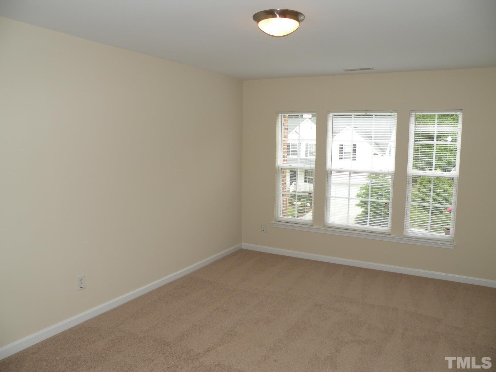 4733 Porchaven Lane Apex, NC 27539 - Photo 18 of 25 an empty room with a window