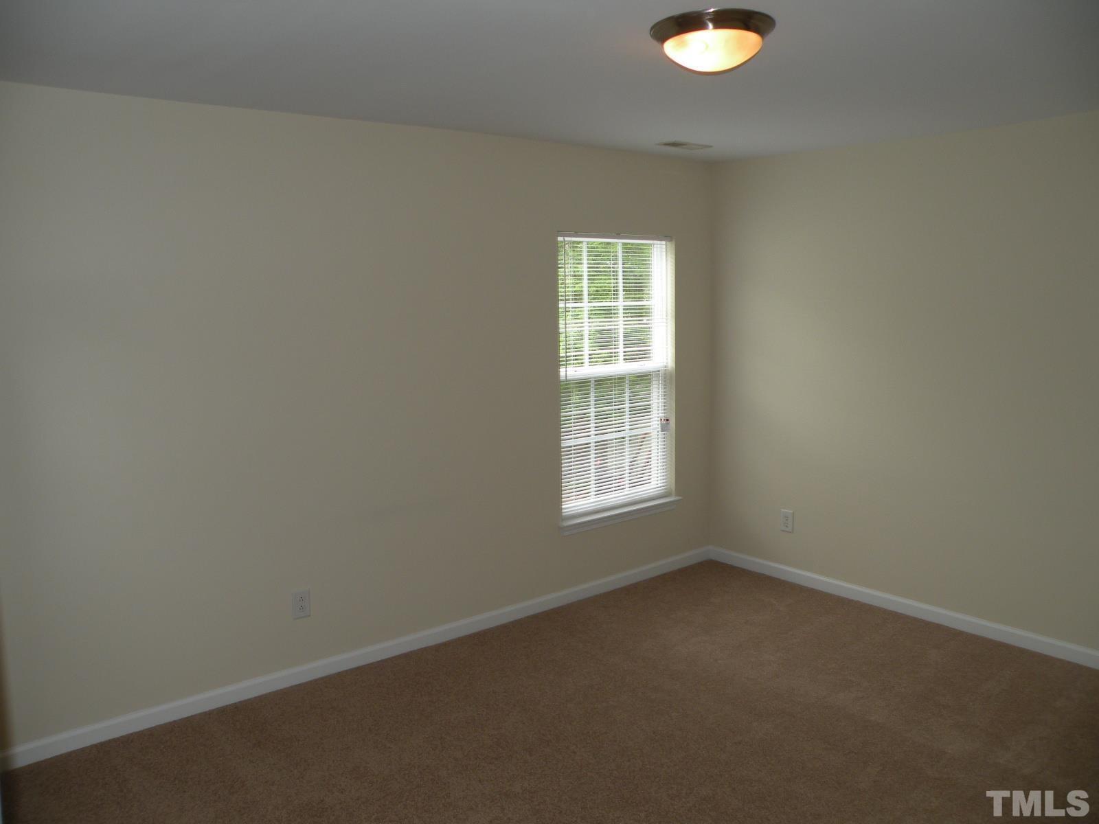 4733 Porchaven Lane Apex, NC 27539 - Photo 20 of 25 an empty room with a window