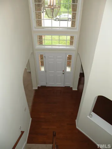 a view of outdoor space with swimming pool and wooden fence