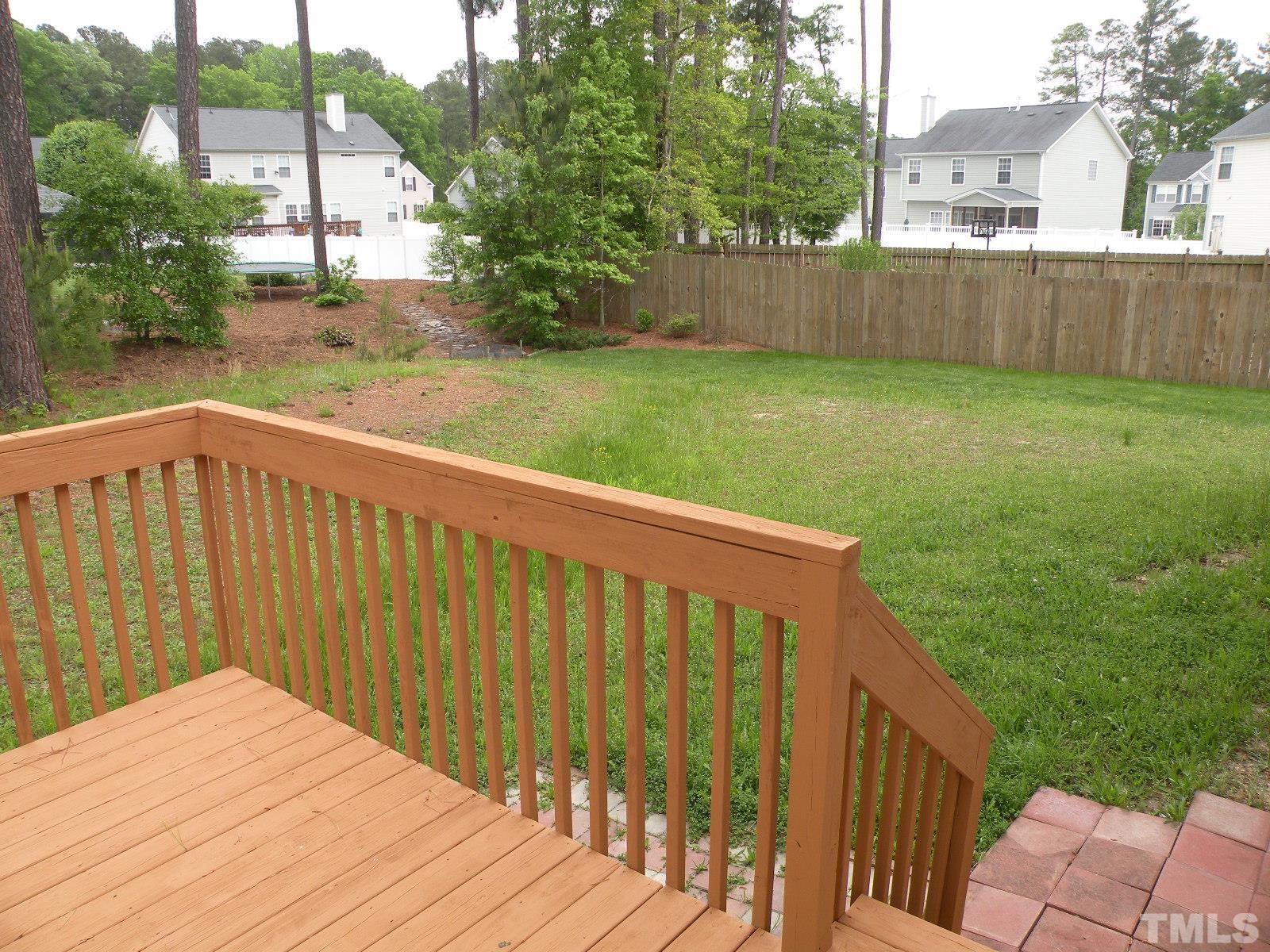 4733 Porchaven Lane Apex, NC 27539 - Photo 23 of 25 a view of a backyard with a garden