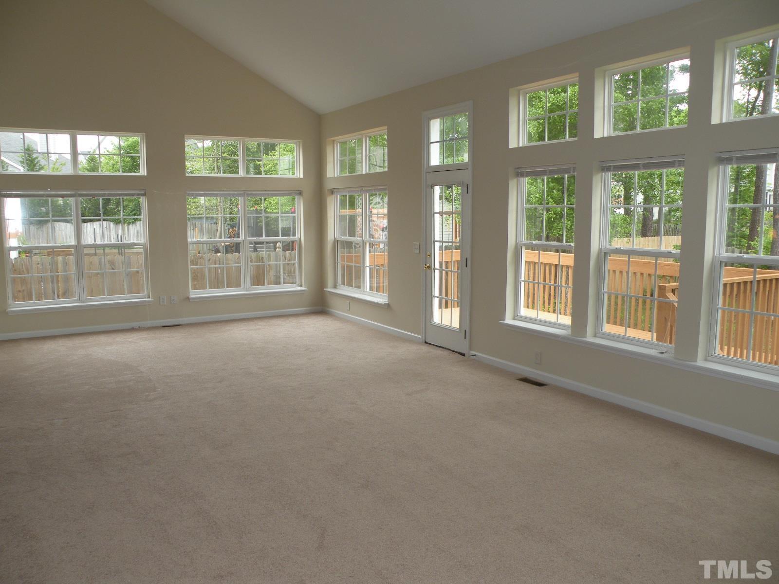 4733 Porchaven Lane Apex, NC 27539 - Photo 3 of 25 a view of an empty room with a large window