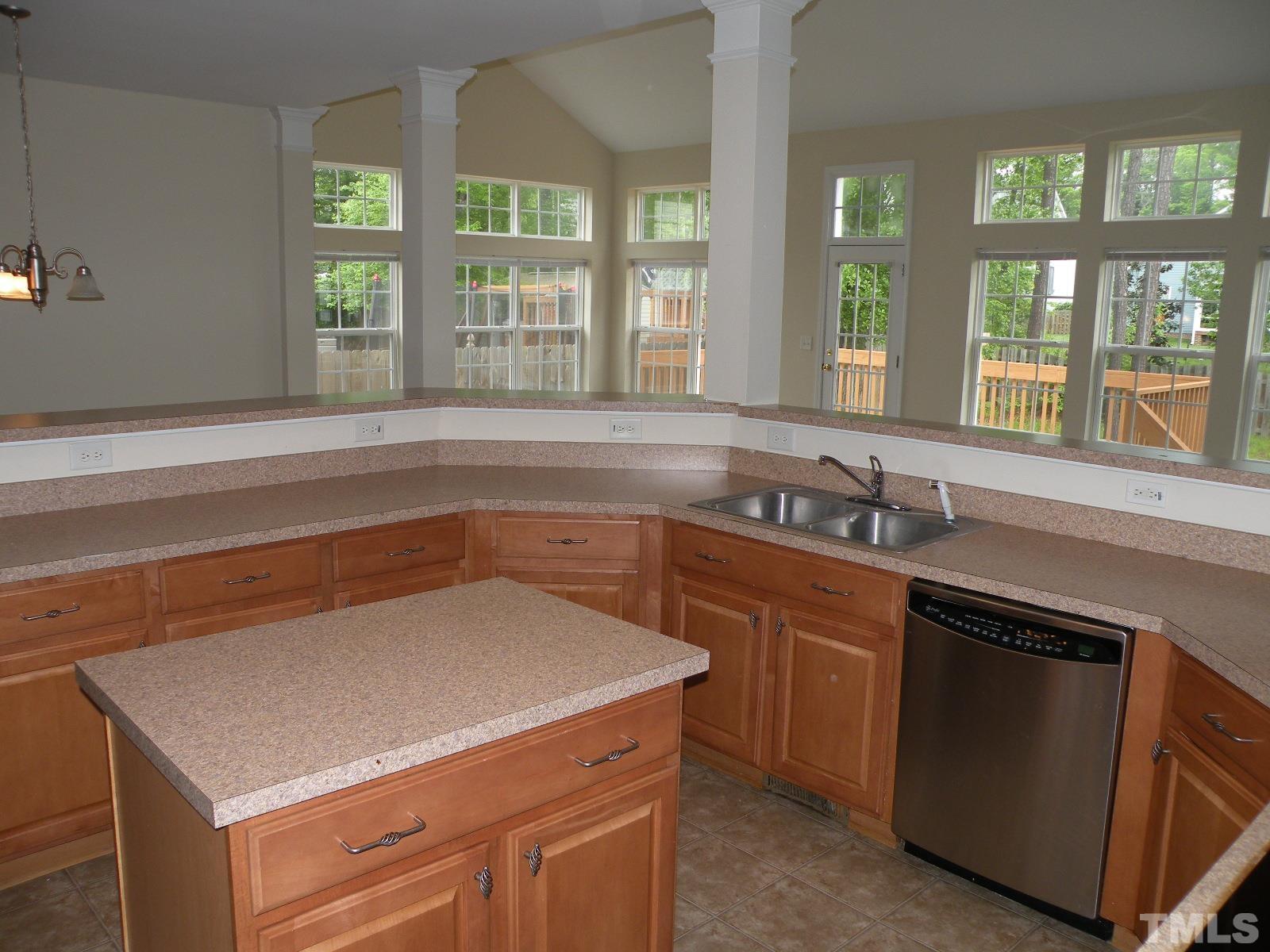 4733 Porchaven Lane Apex, NC 27539 - Photo 5 of 25 a kitchen with a sink and a window