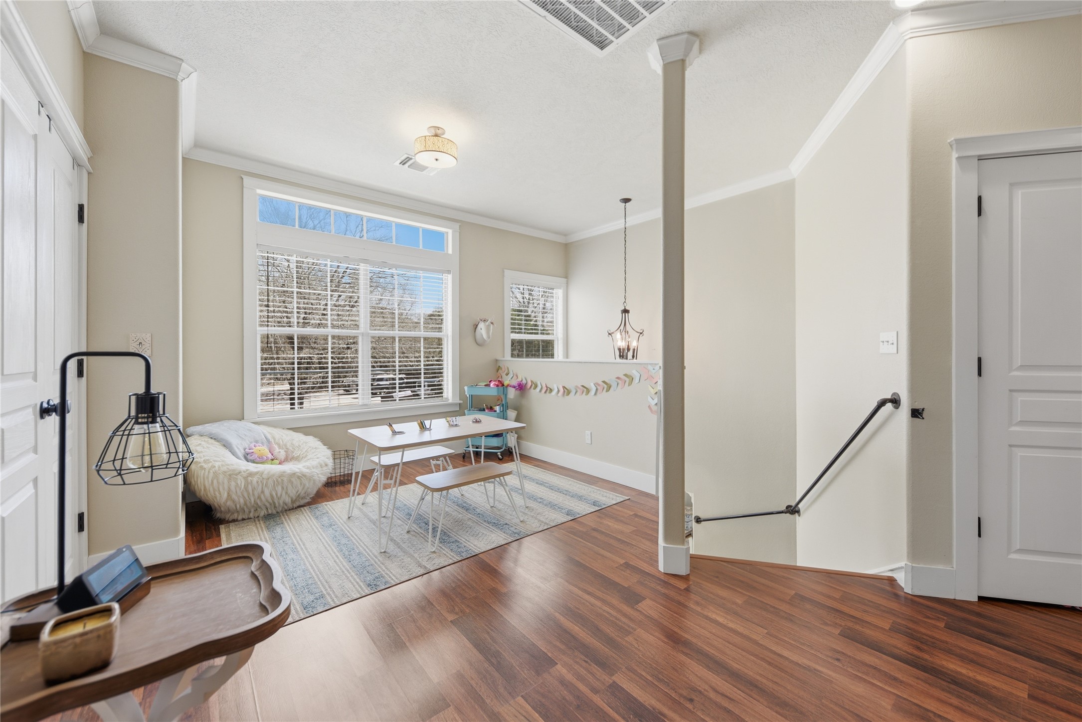 305 Affleck Road Brenham, TX 77833 - Photo 32 of 43 a hallway with a couch and a large window