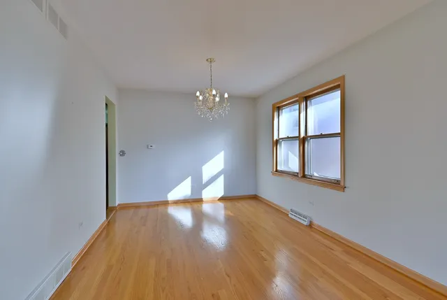 a view of livingroom with window and hardwood floor