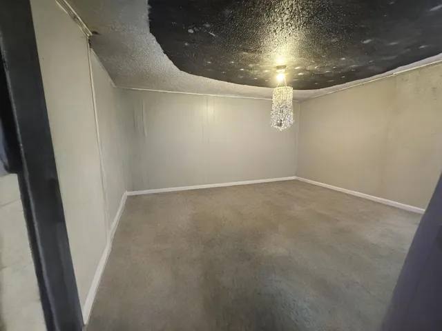 a bathroom with a sink and mirror with toilet