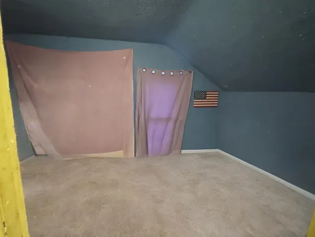 a view of hallway with wooden floor